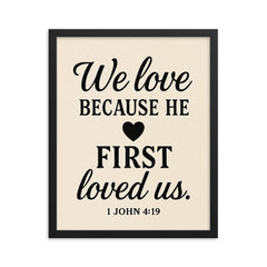 1 John 419 We love because he first loved us framed print on a plain backdrop in size 16"x20".