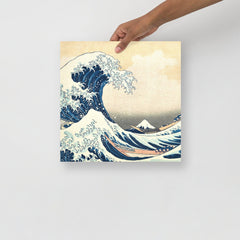 The Great Wave off Kanagawa by Hokusai poster on a plain backdrop in size 14x14”.