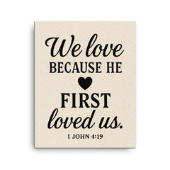 1 John 419 We love because he first loved us canvas print on a plain backdrop in size 16"x20".