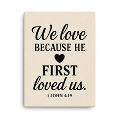 1 John 419 We love because he first loved us canvas print on a plain backdrop in size 18"x24".