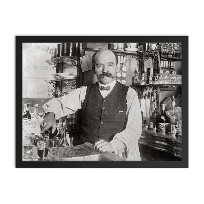 A bartender pouring a drink in 1910, New York City framed print on a plain backdrop in size 18