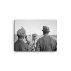 A British Soldier Giving a V-for-Victory Sign to German Prisoners at El Alamein, 26 October 1942 canvas print on a plain backdrop in size 12"x16".