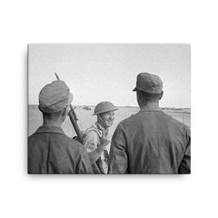 A British Soldier Giving a V-for-Victory Sign to German Prisoners at El Alamein, 26 October 1942 canvas print on a plain backdrop in size 16"x20".