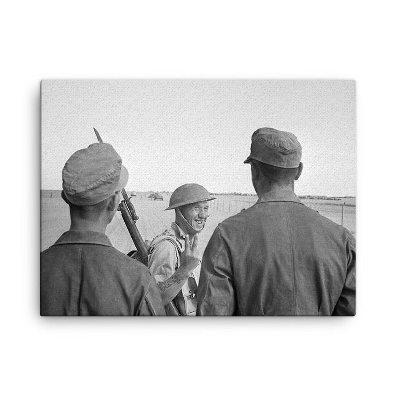A British Soldier Giving a V-for-Victory Sign to German Prisoners at El Alamein, 26 October 1942 canvas print on a plain backdrop in size 18