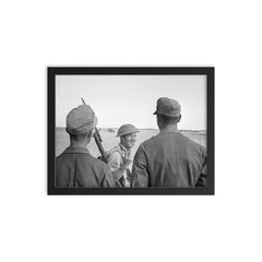 A British Soldier Giving a V-for-Victory Sign to German Prisoners at El Alamein, 26 October 1942 framed print on a plain backdrop in size 12"x16".