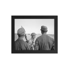 A British Soldier Giving a V-for-Victory Sign to German Prisoners at El Alamein, 26 October 1942 framed print on a plain backdrop in size 8"x10".