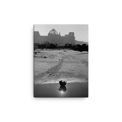 A Broken German Stahlhelm in a Puddle with Reichstag Ruins, Berlin canvas print on a plain backdrop in size 12"x16".