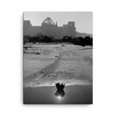 A Broken German Stahlhelm in a Puddle with Reichstag Ruins, Berlin canvas print on a plain backdrop in size 18"x24".