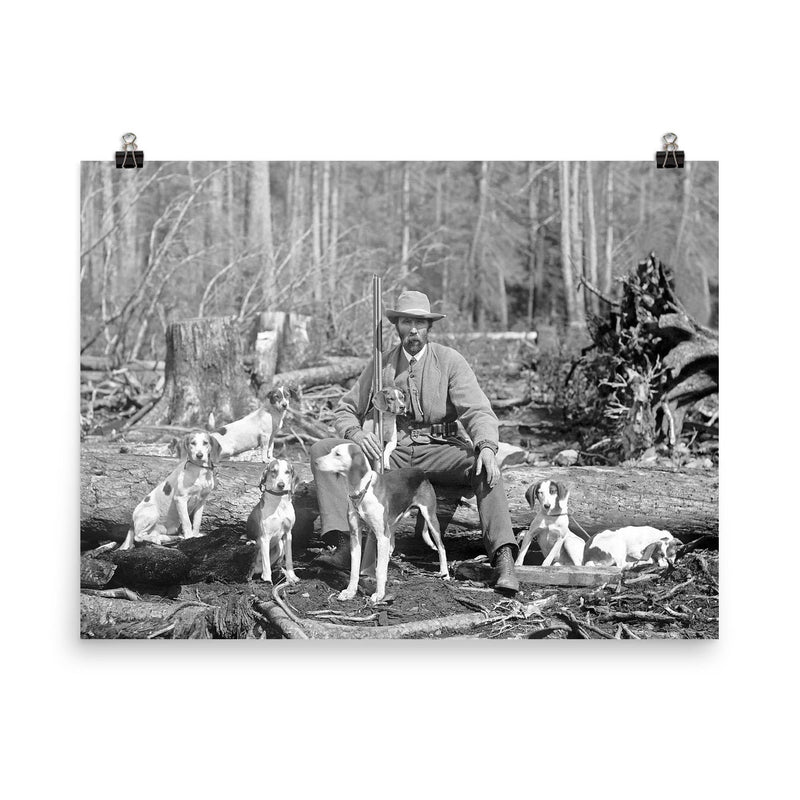 A deer hunter poses for a portrait with his hounds, 1897 poster on a plain backdrop in size 8