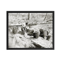 A man operating a moonshine still in a remote location - Texas, 1923 framed print on a plain backdrop in size 16"x20".