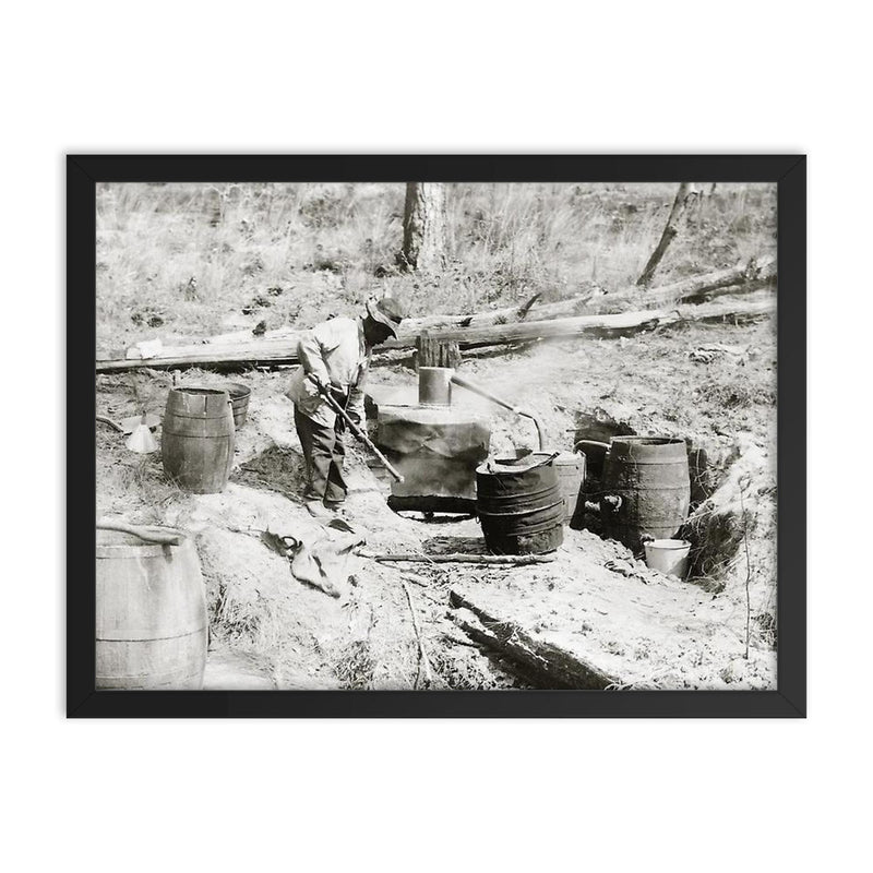A man operating a moonshine still in a remote location - Texas, 1923 framed print on a plain backdrop in size 18