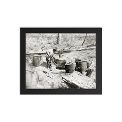 A man operating a moonshine still in a remote location - Texas, 1923 framed print on a plain backdrop in size 8"x10".