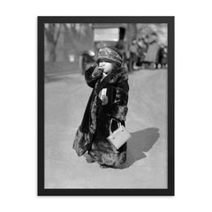 A midget flapper girl wearing the latest flapper fashions and smoking a cigarette, Washington, DC 1924 framed print on a plain backdrop in size 18"x24".