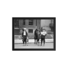 A portrait of boys posing with a dog and a pony and holding a sign announcing that it is 'Be Kind To Animals Week', 1923 framed print on a plain backdrop in size 12"x16".