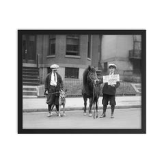 A portrait of boys posing with a dog and a pony and holding a sign announcing that it is 'Be Kind To Animals Week', 1923 framed print on a plain backdrop in size 16"x20".