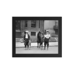 A portrait of boys posing with a dog and a pony and holding a sign announcing that it is 'Be Kind To Animals Week', 1923 framed print on a plain backdrop in size 8"x10".