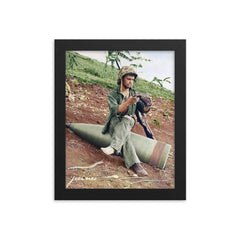 A US Marine Clearing His Boot on a 16” Naval Artillery Shell, Saipan, June 1944 framed print on a plain backdrop in size 8"x10".