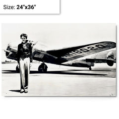 Amelia Earhart standing in front of the Lockheed Electra metal print on a plain backdrop in size 24"x36".