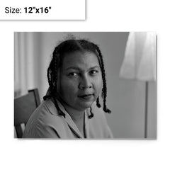 Bell Hooks metal print on a plain backdrop in size 12"x16".