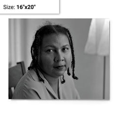 Bell Hooks metal print on a plain backdrop in size 16"x20".