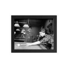 Billiards champ - a female champion billiards player lines up a shot, 1910 framed print on a plain backdrop in size 8"x10".