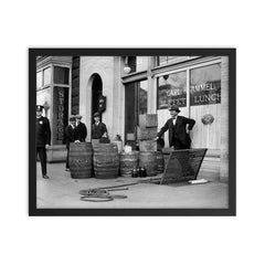Bootleg liquor raid - Police posing with barrels of bootleg liquor seized in a raid on a Speakeasy, 1923 framed print on a plain backdrop in size 16"x20".