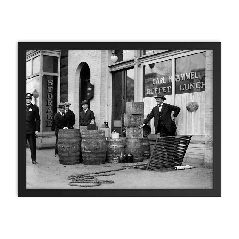 Bootleg liquor raid - Police posing with barrels of bootleg liquor seized in a raid on a Speakeasy, 1923 framed print on a plain backdrop in size 18