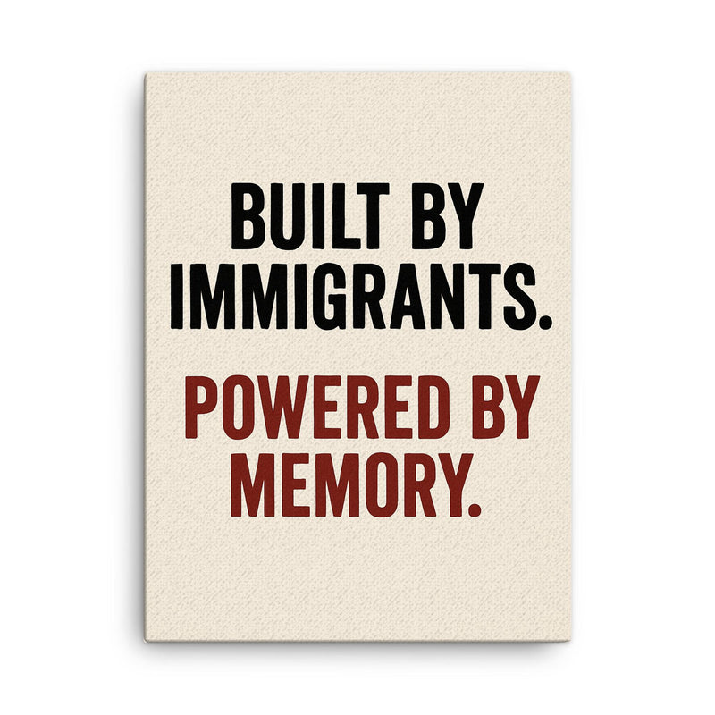 Built by immigrants Powered by memory canvas print on a plain backdrop in size 18