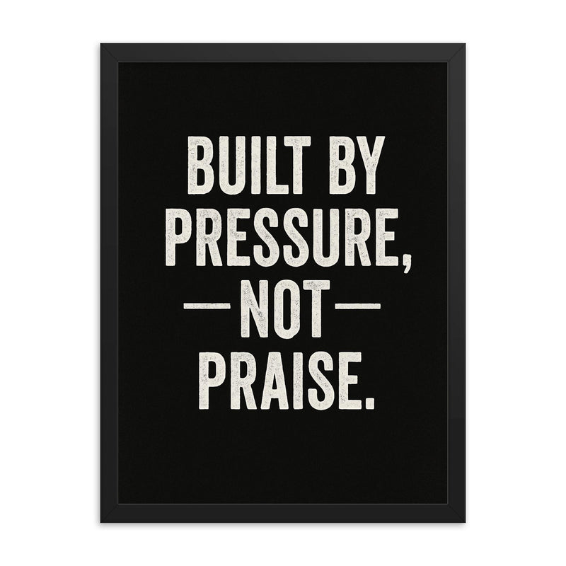Built by pressure not praise framed print on a plain backdrop in size 18