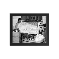 Captain Lewis Nixon of the 101st Airborne Celebrating with Goering's Private Liquor Collection, Austria, May 4, 1945 framed print on a plain backdrop in size 8"x10".