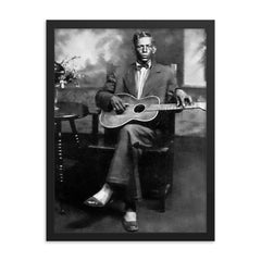 Charley Patton framed print on a plain backdrop in size 18"x24".