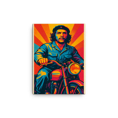Che Guevara in bold pop art colors riding a classic motorcycle canvas print on a plain backdrop in size 12"x16".