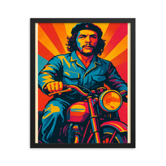 Che Guevara in bold pop art colors riding a classic motorcycle framed print on a plain backdrop in size 16"x20".