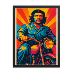 Che Guevara in bold pop art colors riding a classic motorcycle framed print on a plain backdrop in size 18"x24".