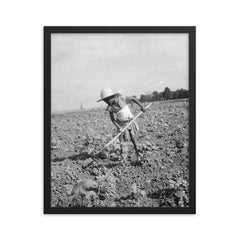 Child of impoverished tenant family working on farm, Alabama by Dorothea Lange framed print on a plain backdrop in size 16"x20".