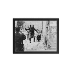 Conrad Schumann Defecting from the German Democratic Republic, August 15, 1961 framed print on a plain backdrop in size 12"x16".
