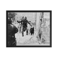 Conrad Schumann Defecting from the German Democratic Republic, August 15, 1961 framed print on a plain backdrop in size 16"x20".