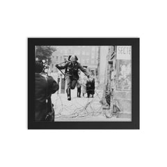 Conrad Schumann Defecting from the German Democratic Republic, August 15, 1961 framed print on a plain backdrop in size 8"x10".
