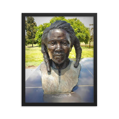 Dedan Kimathi framed print on a plain backdrop in size 16"x20".