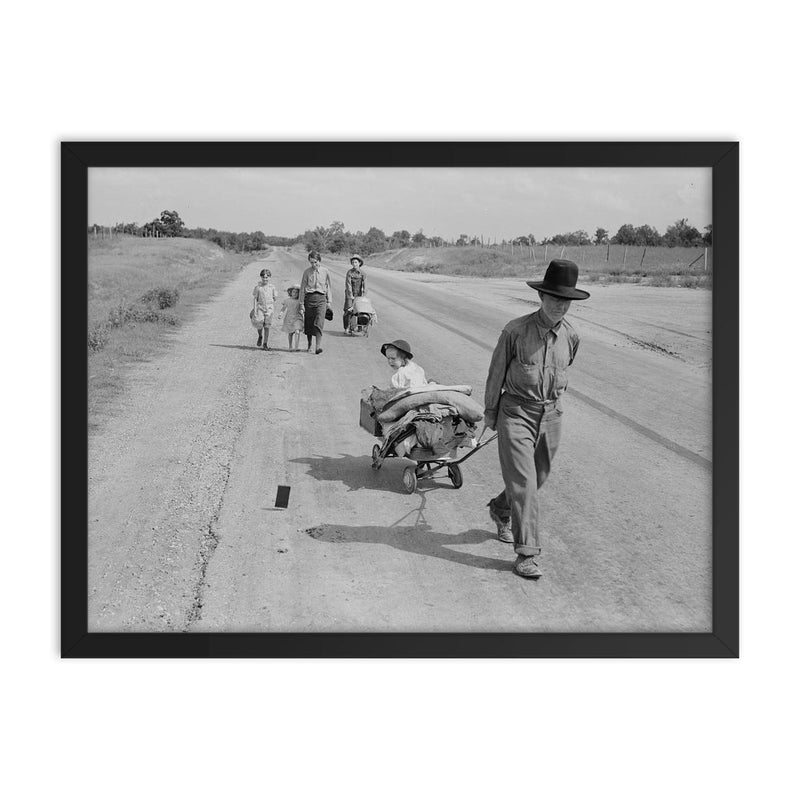 Family walking on highway by Dorothea Lange framed print on a plain backdrop in size 18