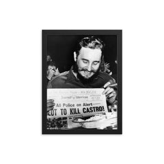 Fidel Castro Laughing at Newspaper Headline, New York 1959 framed print on a plain backdrop in size 12"x16".