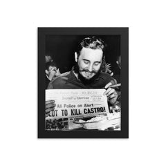 Fidel Castro Laughing at Newspaper Headline, New York 1959 framed print on a plain backdrop in size 8"x10".