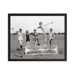 Flapper Girls Playing Golf, 1926 - A flapper girl tees off while standing on a giant block of ice, Washington, DC framed print on a plain backdrop in size 16"x20".
