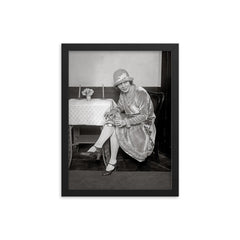 Flask Hidden in Garter, 1926 - A woman reveals a flask hidden in her garter during the Prohibition era framed print on a plain backdrop in size 12"x16".
