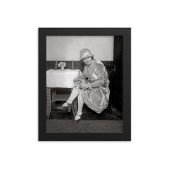 Flask Hidden in Garter, 1926 - A woman reveals a flask hidden in her garter during the Prohibition era framed print on a plain backdrop in size 8"x10".