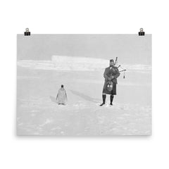 Gilbert Kerr bagpiping with an Emperor Penguin poster on a plain backdrop in size 8"x10".