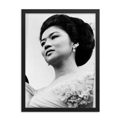 Imelda Marcos framed print on a plain backdrop in size 18"x24".