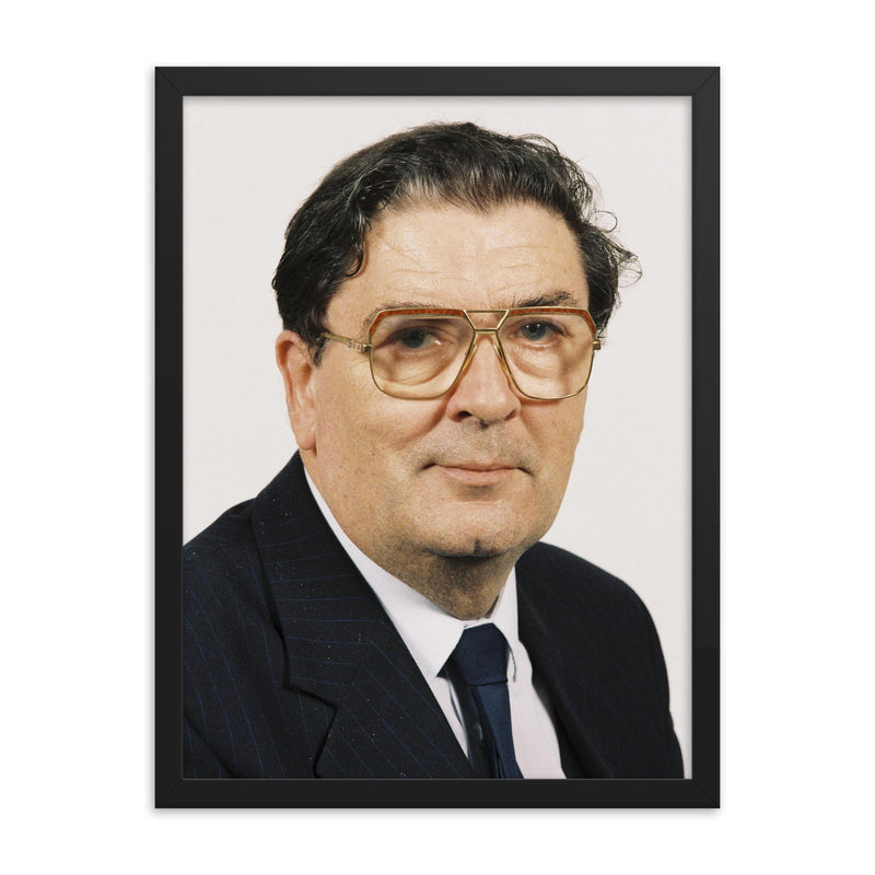 John Hume framed print on a plain backdrop in size 18