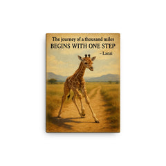 Journey of a thousand miles quote baby giraffe taking first step canvas print on a plain backdrop in size 12"x16".