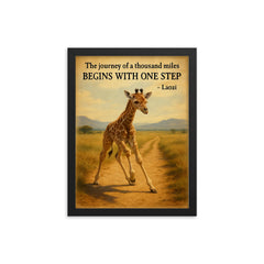 Journey of a thousand miles quote baby giraffe taking first step framed print on a plain backdrop in size 12"x16".